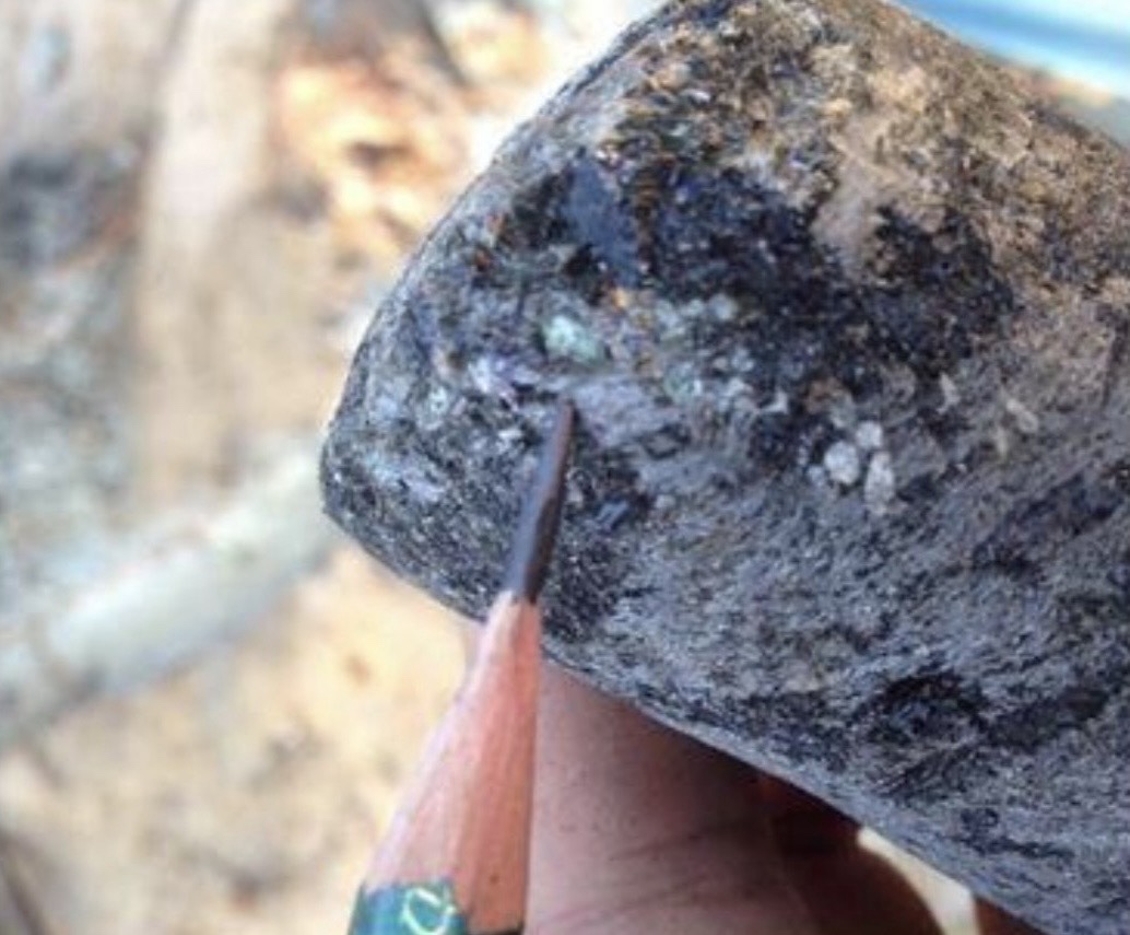 Core drill sample showing light green emerald mineralisation